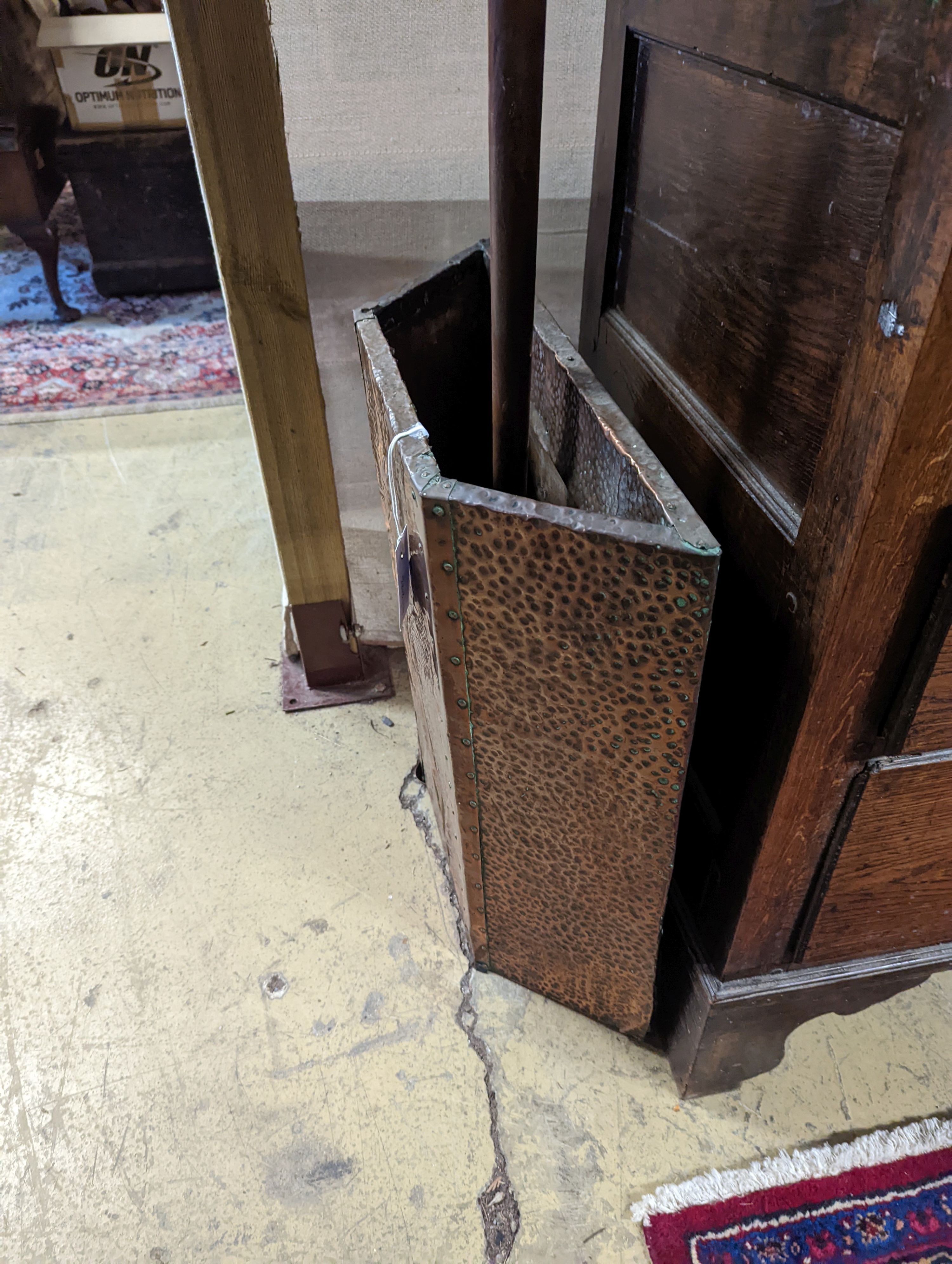 An early 20th century embossed copper stick stand, height 60cm, together with a Victorian copper warming pan